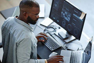 Web programmer working at a computer